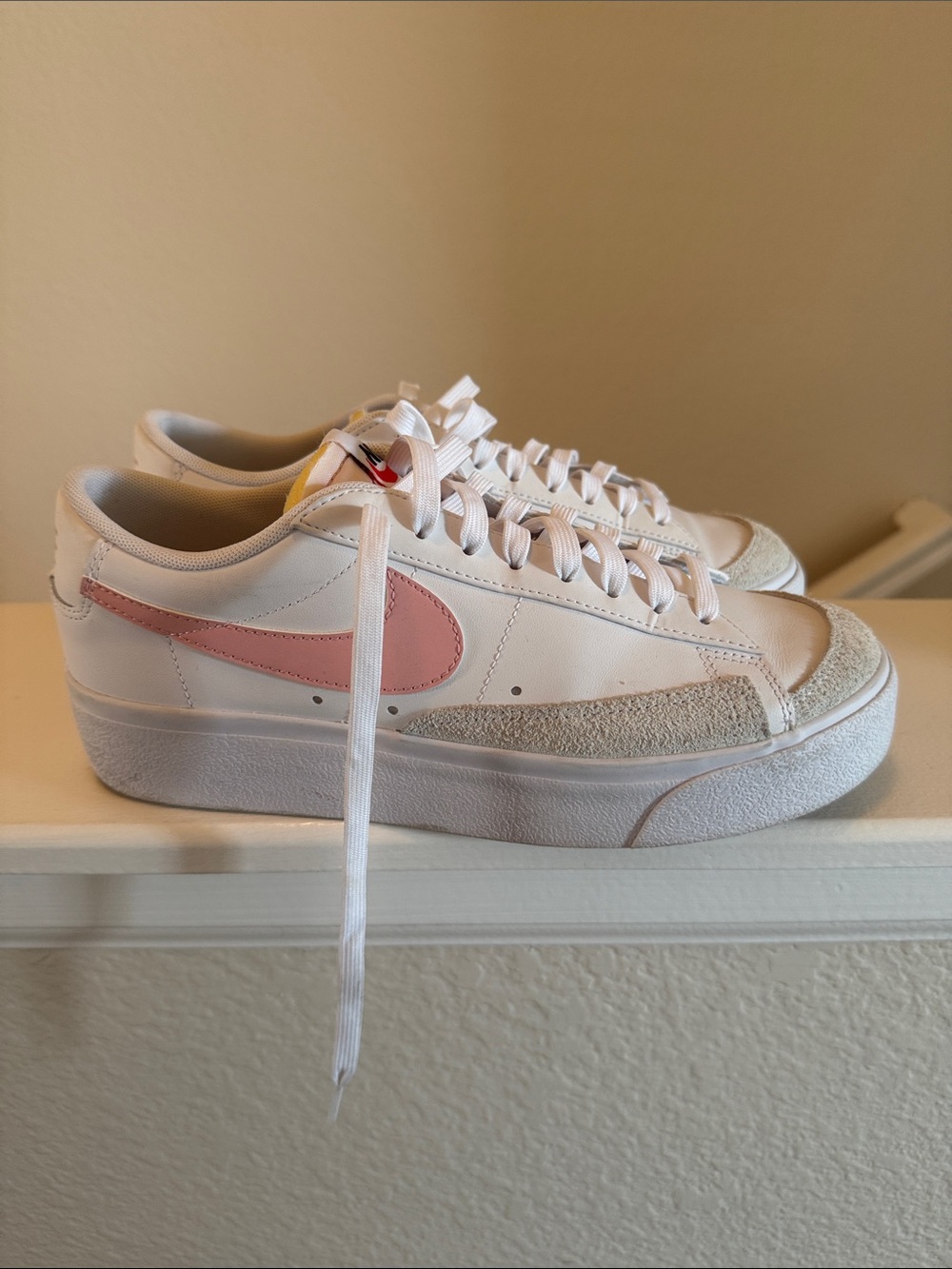 Nike Women's White Sneakers with Pink Swoosh
